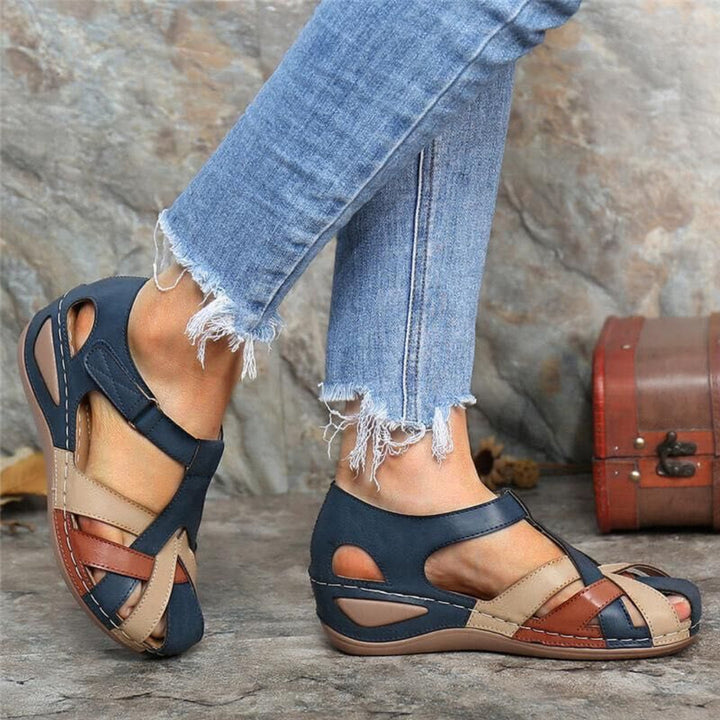 Stylish women's closed toe sandals with a vibrant colorblock design, perfect for casual wear and spring fashion.