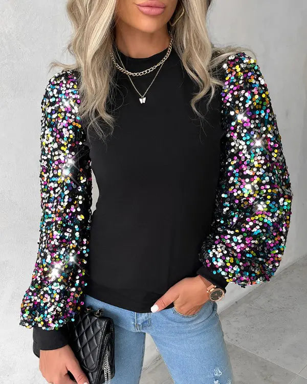 Fashionable women's colourful balloon sleeve top with eye-catching contrast panels and subtle sequin accents.