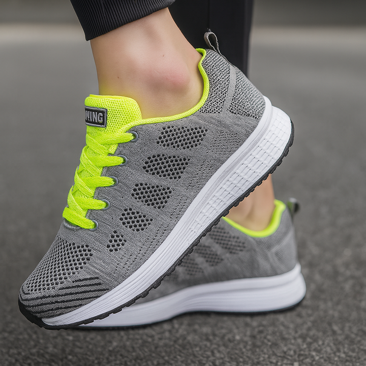 Women's comfort athletic sneakers with arch support in breathable mesh, gray and pink.