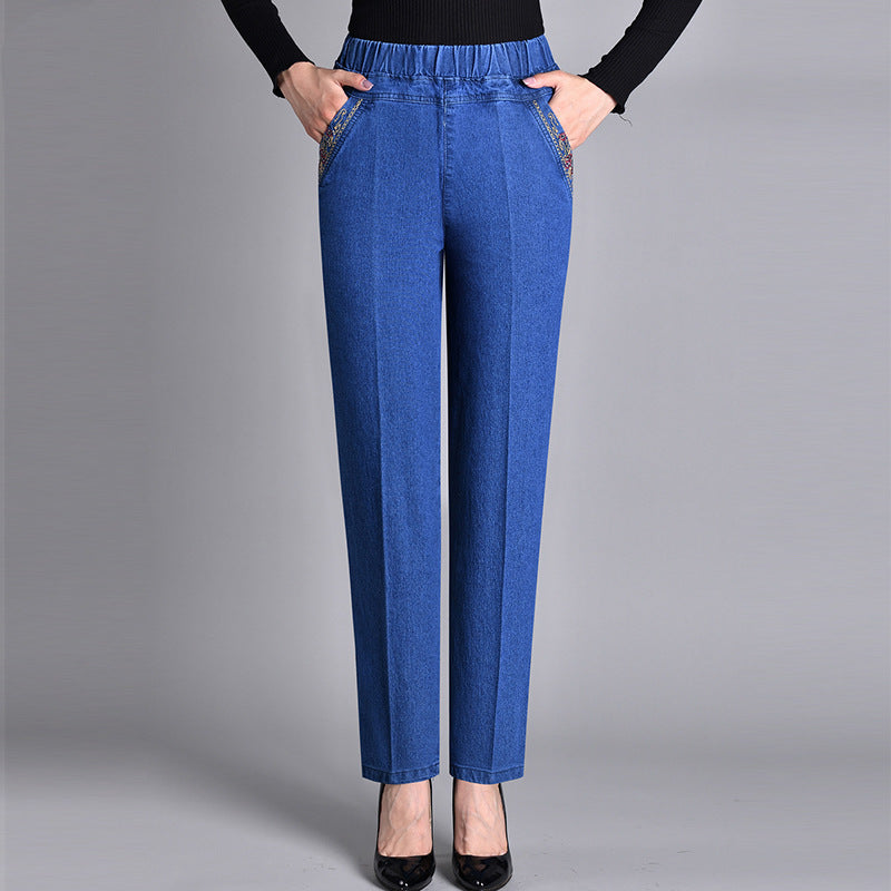Women's comfort-fit straight leg denim jeans with elastic waistband, perfect for casual fall fashion.