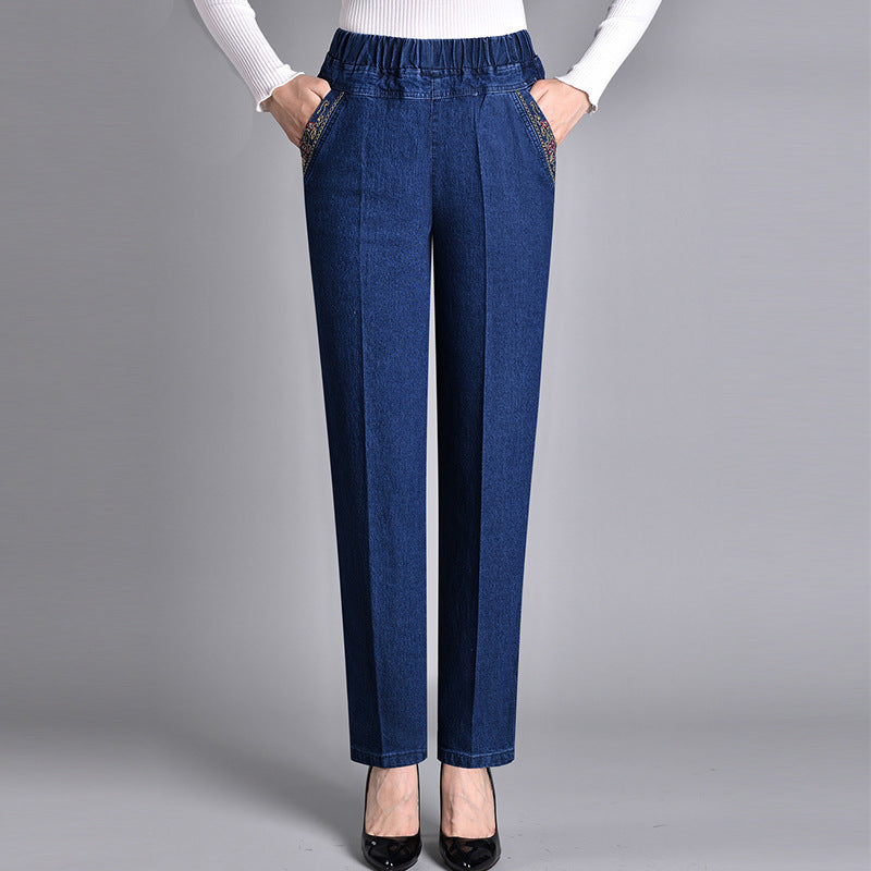 Close-up of elastic waistband on women's comfort-fit jeans, highlighting stretch and casual style.
