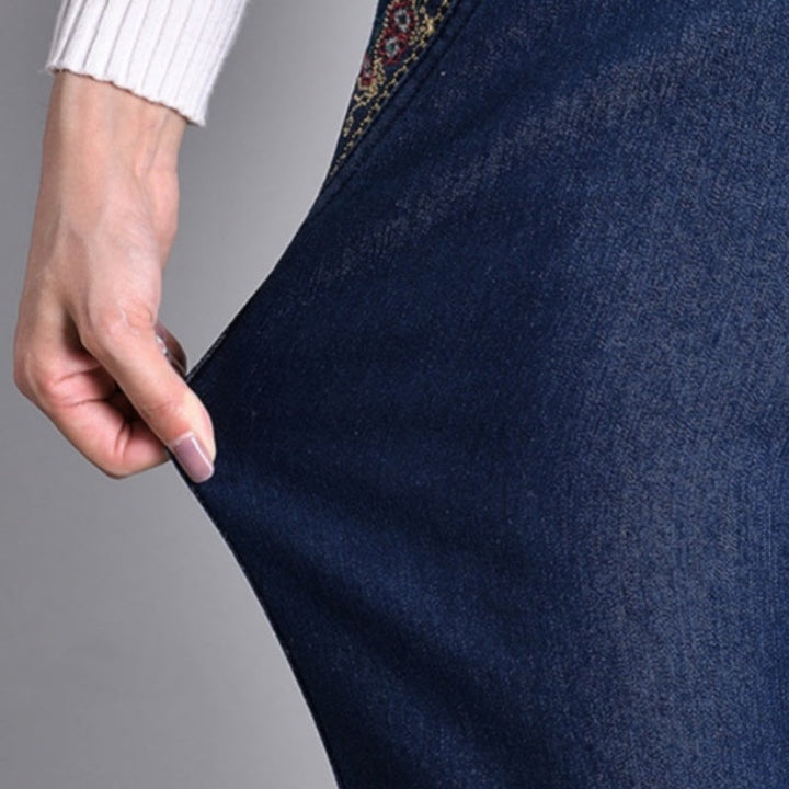 Women's denim jeans with practical pockets, straight leg design, and comfortable elastic waist for winter.