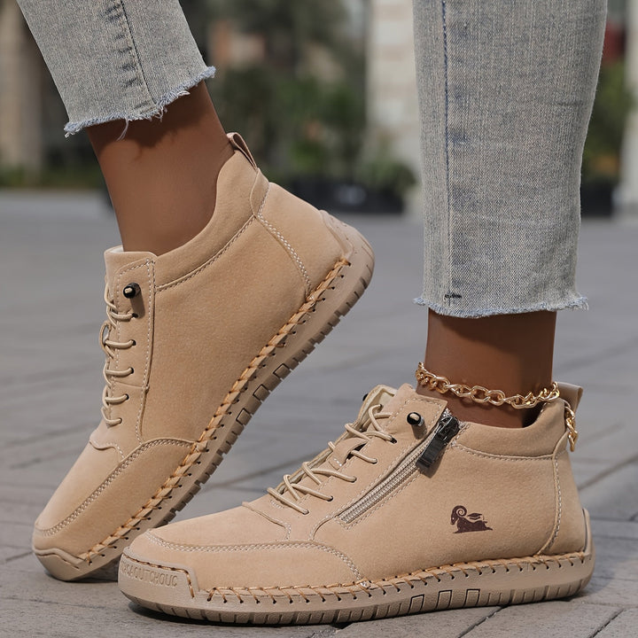 Detail shot of the sole on women's comfort zip-up walking shoes, indicating good traction.