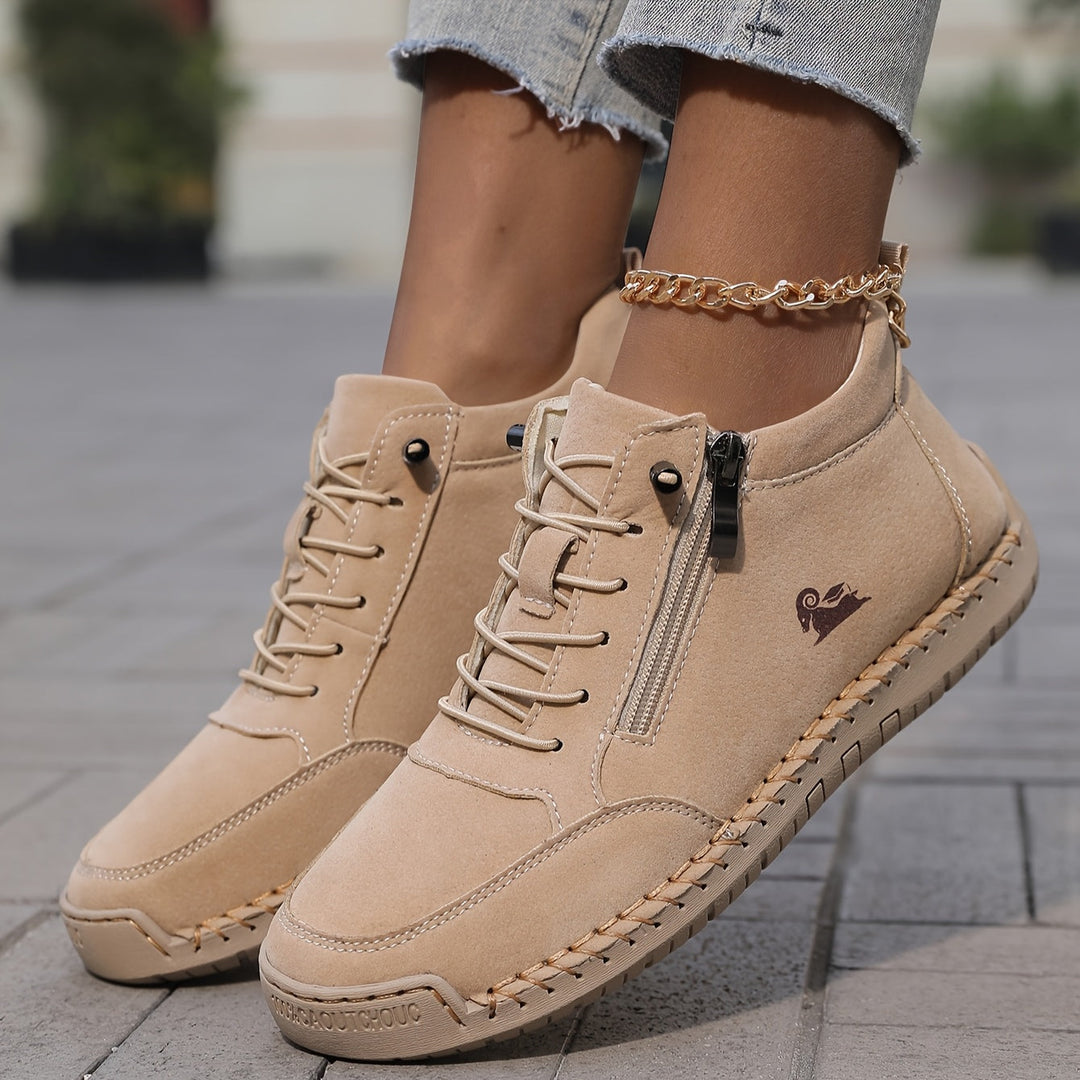 Front view of women's zip-up Walking Sneakers, emphasizing their sleek athletic design.