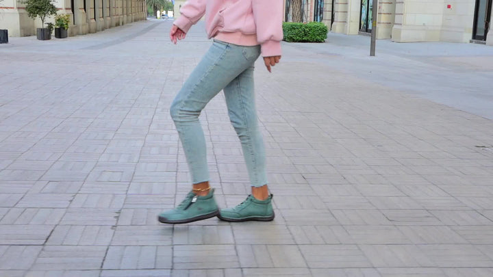 Elegant women's zip-up low-top sneakers, combining comfort footwear with sophisticated athletic style.