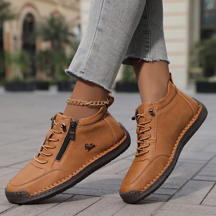 Black zip-up women's walking sneakers, offering comfort and style for everyday wear.