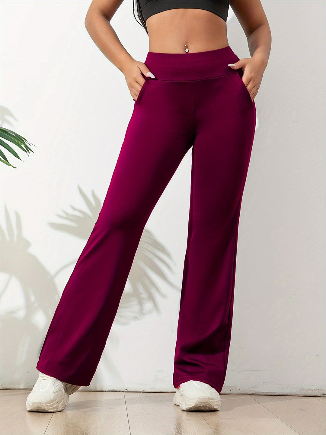 Women's comfortable activewear flared yoga pants, designed with an elastic waist for flexible movement.