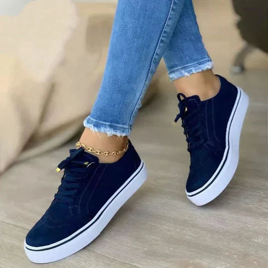 Soft white women's lace-up sneakers, ideal for everyday casual wear and comfortable walking