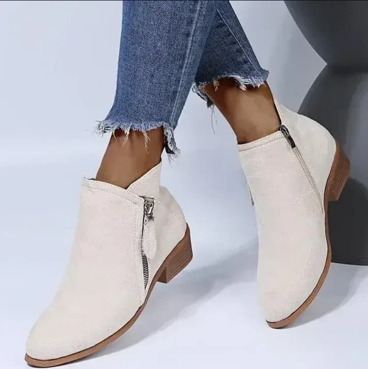 Women's comfortable black leather ankle boots with side zipper, ergonomic design, and non-slip sole for winter.