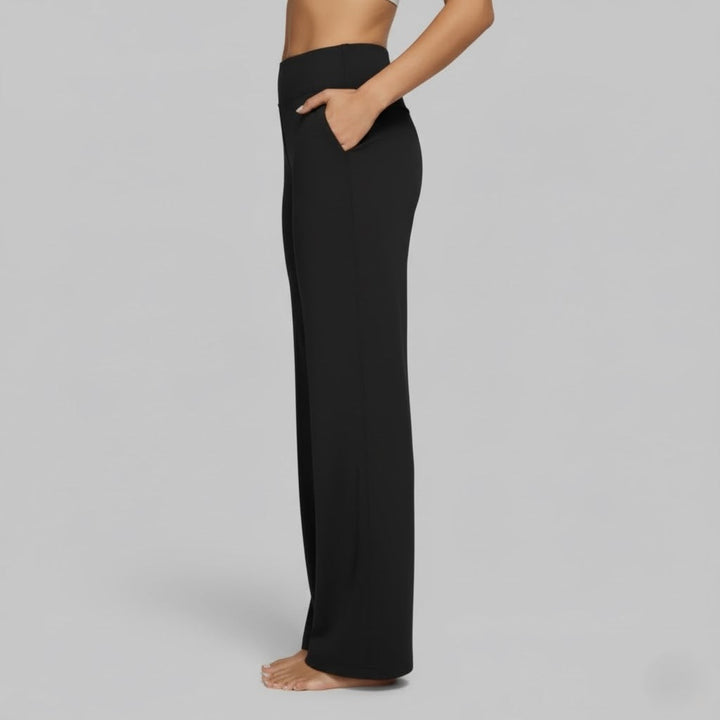 Detail shot of the waistband of comfortable women's black stretch pants, designed for comfort.