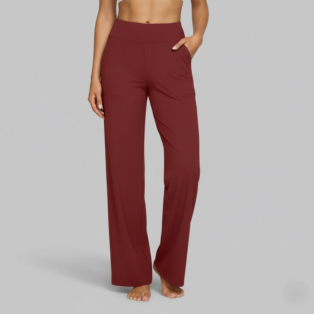 Overhead view of women's comfortable black stretch pants, emphasizing their simple, chic design.