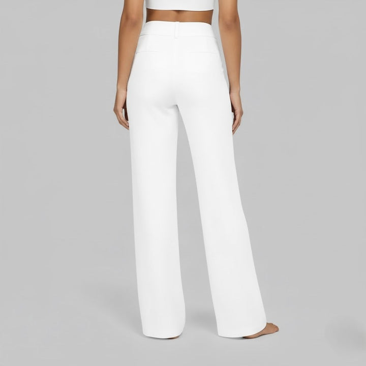 Full body shot of a woman in comfortable black stretch pants, demonstrating a relaxed fit.
