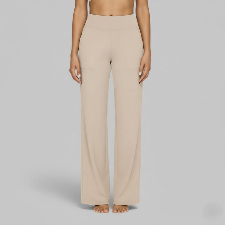 Close-up of a woman in comfortable olive green stretch trousers, showing fabric detail.