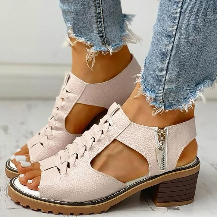 Women's comfortable block heel sandals with stylish woven upper & convenient zip closure, perfect for summer.