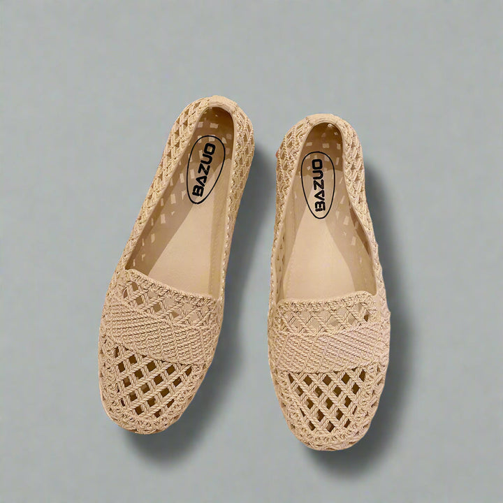 Stylish women's slip-on flats in a neutral color, perfect for all-day comfort and breathability