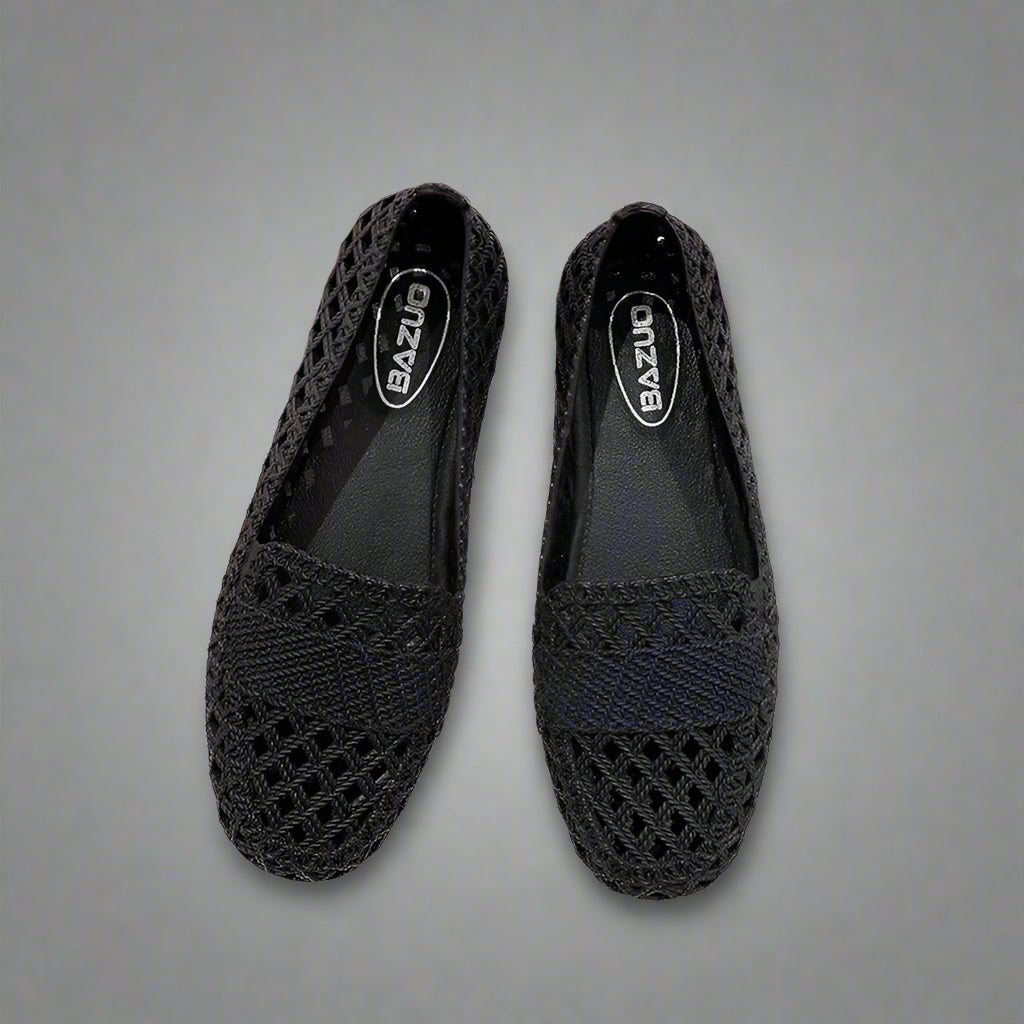 Close-up of a women's casual slip-on flat shoe, showcasing its breathable construction for spring/summer