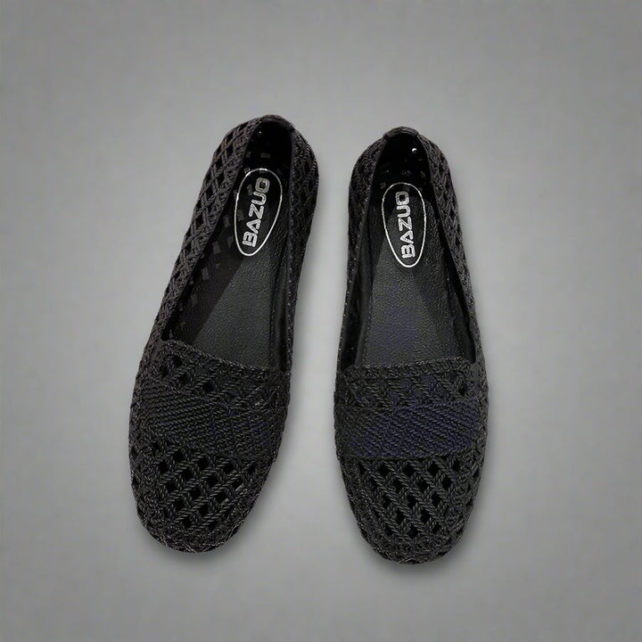 Close-up of a women's casual slip-on flat shoe, showcasing its breathable construction for spring/summer