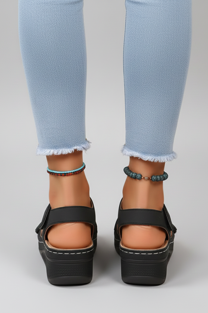 Close-up of the comfortable loop strap and wedge heel on women's casual sandals