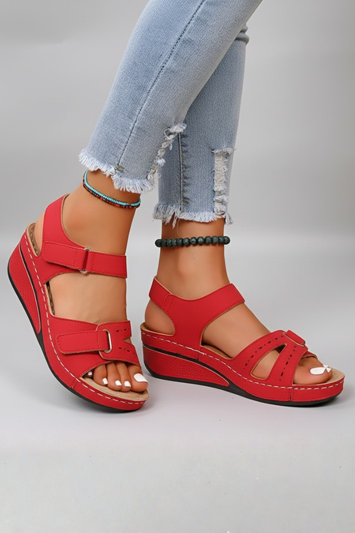 Women's comfortable wedge sandals in a vibrant color, featuring a practical loop strap design