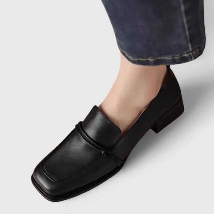 Women's comfortable classic slip-on loafers in a light neutral color, ideal for summer footwear and casual style.