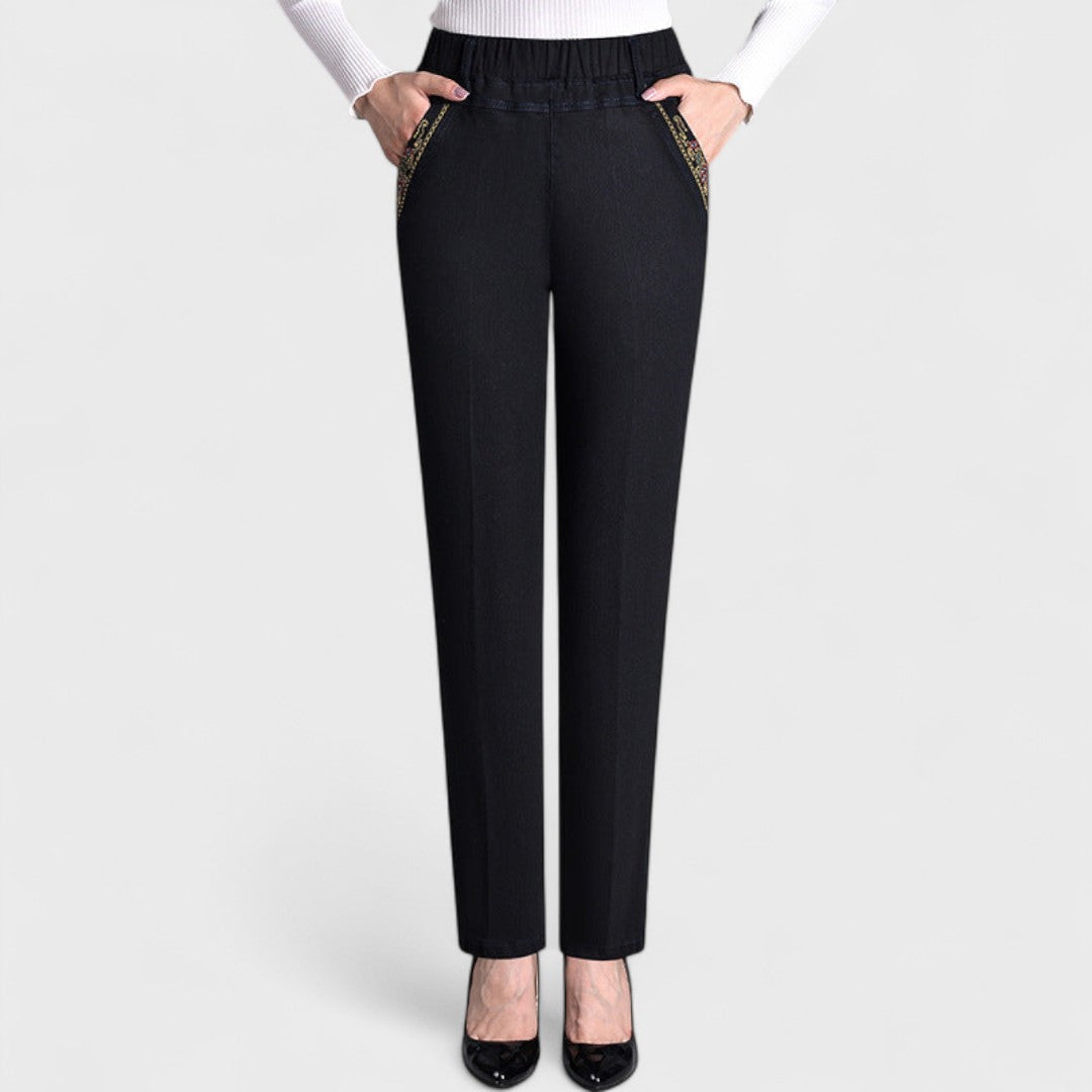 Soft denim elastic waist stretch jeans for women with practical side pockets, comfort fit.