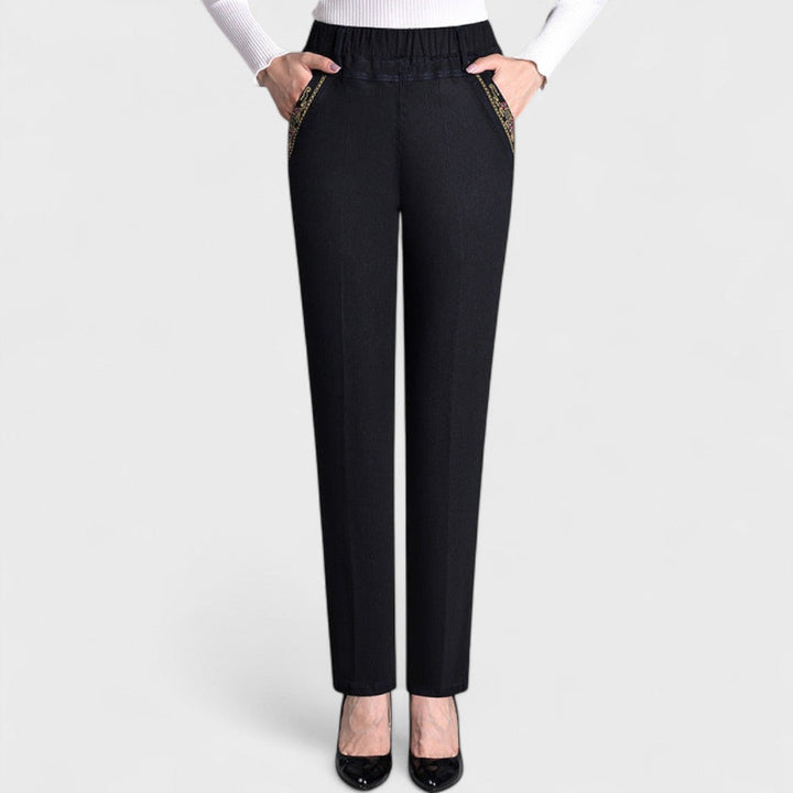 Soft denim elastic waist stretch jeans for women with practical side pockets, comfort fit.