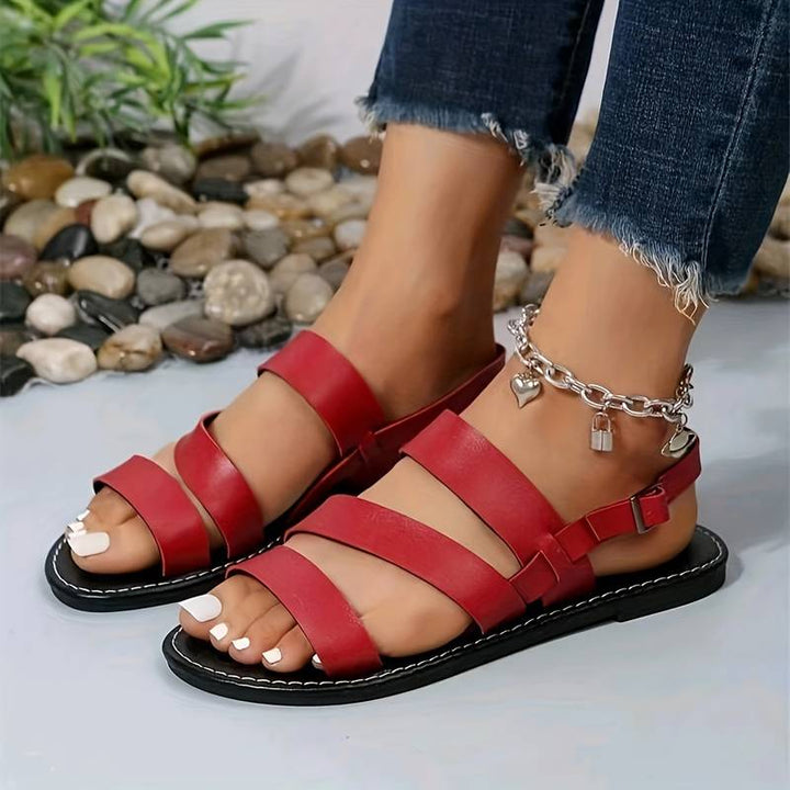 Casual women's flat strappy sandals with open toe, ideal for beach, holiday, or everyday summer fashion.
