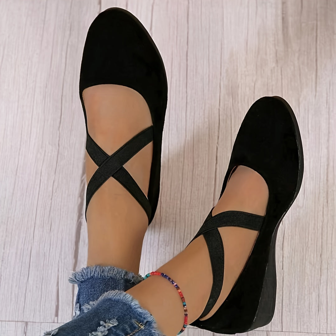 Stylish women's wedge sandals with a low flat heel, offering comfort for extended wear.