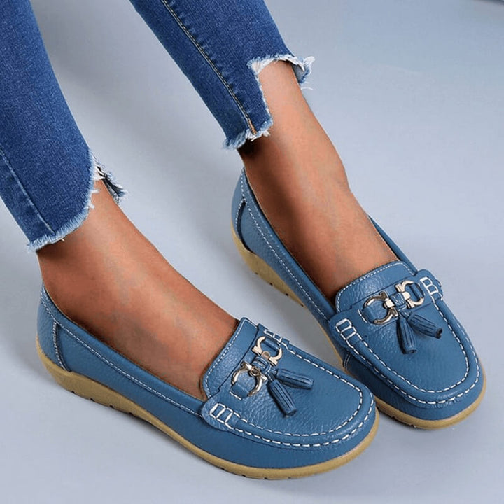 Elegant women's leather slip-ons with timeless style, ideal for casual outfits or smart office wear.
