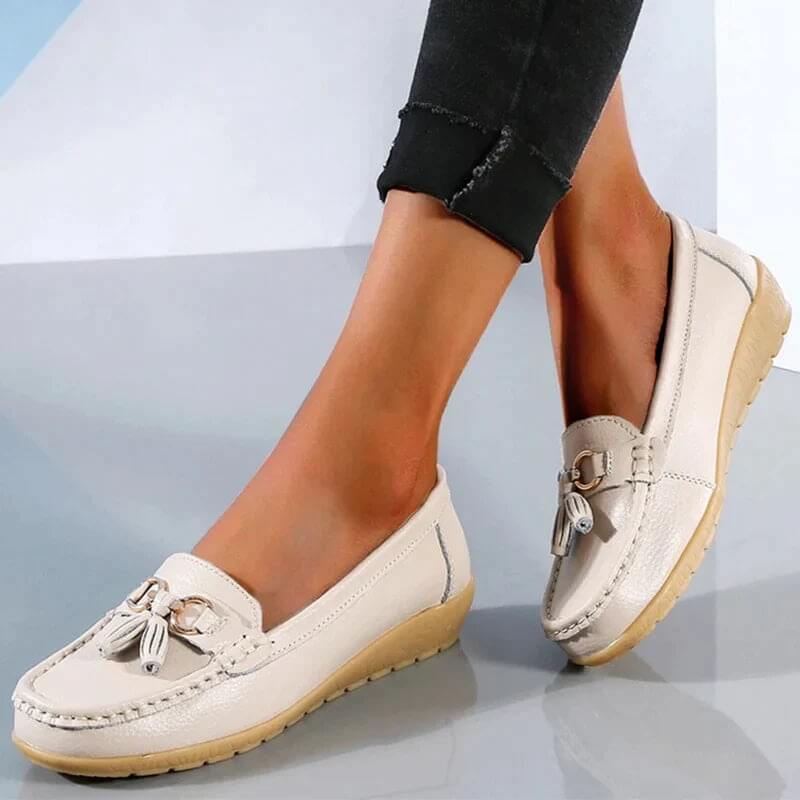 Premium women's leather slip-ons with elegant design, ensuring comfort and versatile style.