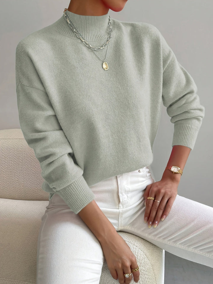 Women's comfortable lilac mock neck sweater, relaxed fit, perfect for spring layering.