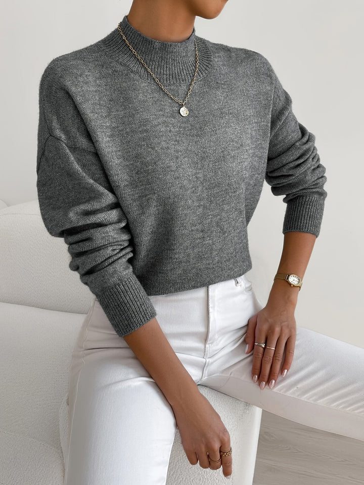 Soft and cozy women's long sleeve mock neck sweater, perfect for cool spring days.