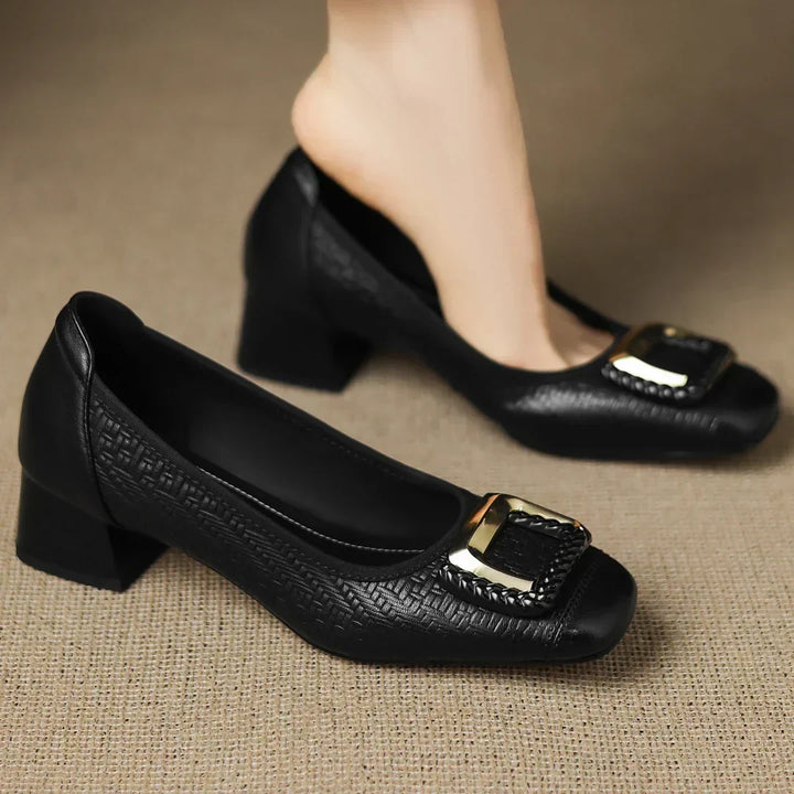 Everyday women's heels: comfortable black block heels with a low profile, square toe, and eye-catching gold buckle
