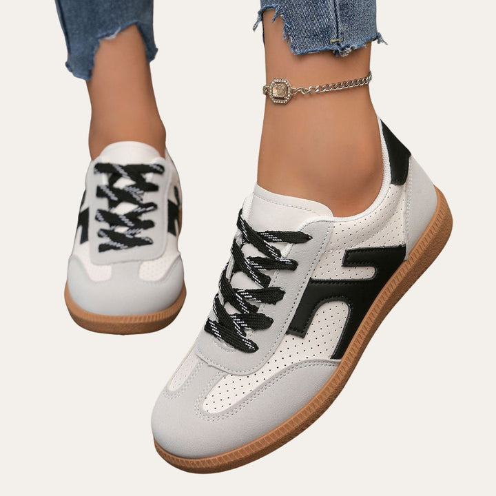 Women's comfortable low top casual sneakers in white for everyday wear and spring footwear.