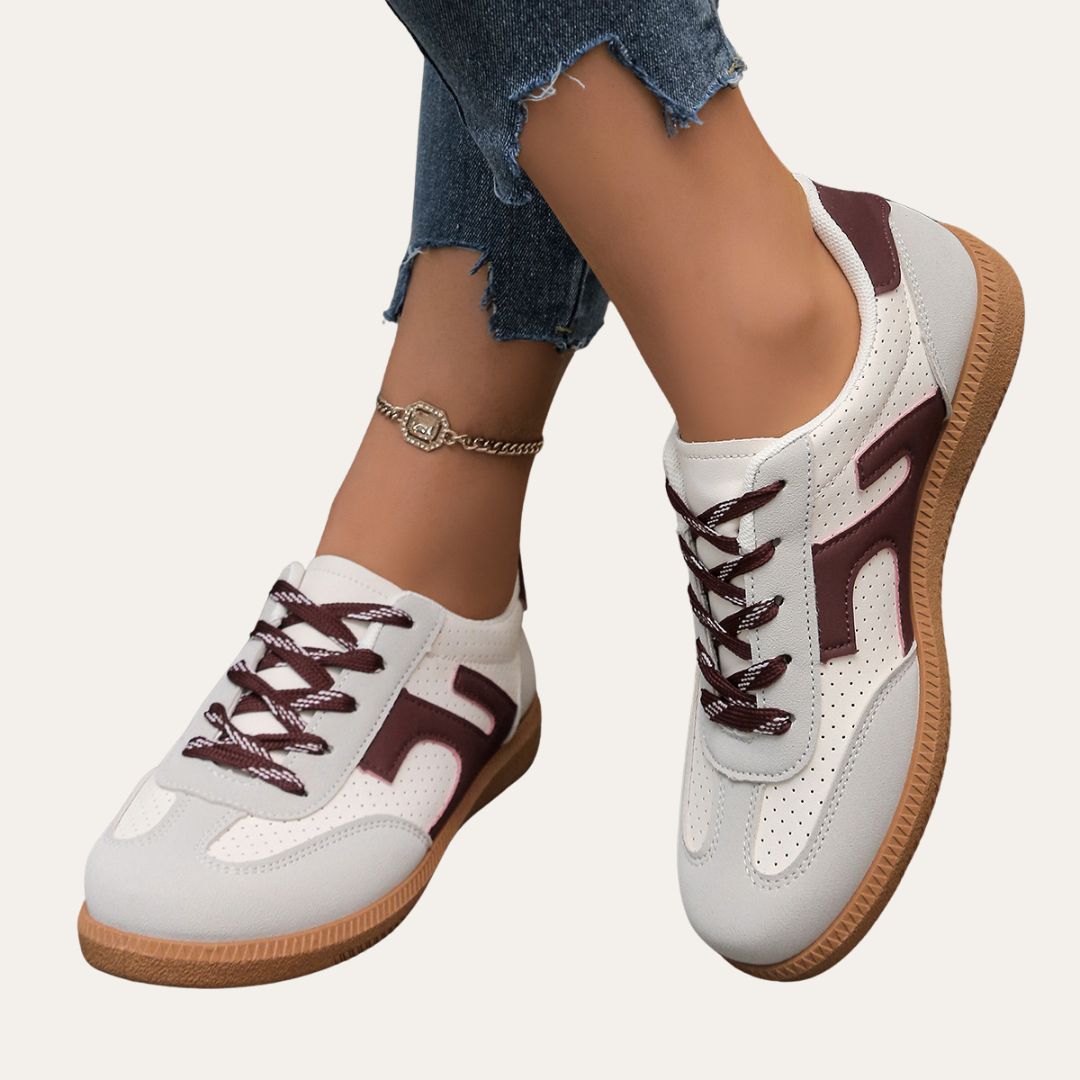 Stylish pastel pink low top casual sneakers for women, perfect for spring fashion footwear.