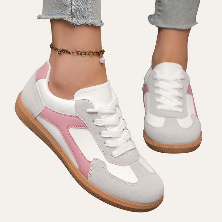 Fashionable grey low top sneakers for women, offering comfort and style for casual ensembles.