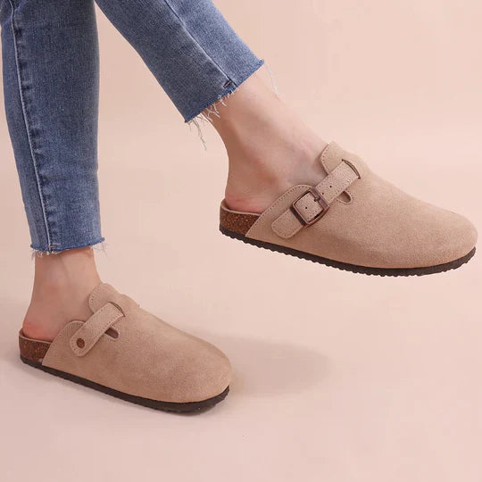 Women's comfortable orthopedic slippers for indoor & outdoor wear. Features arch support & adjustable strap.