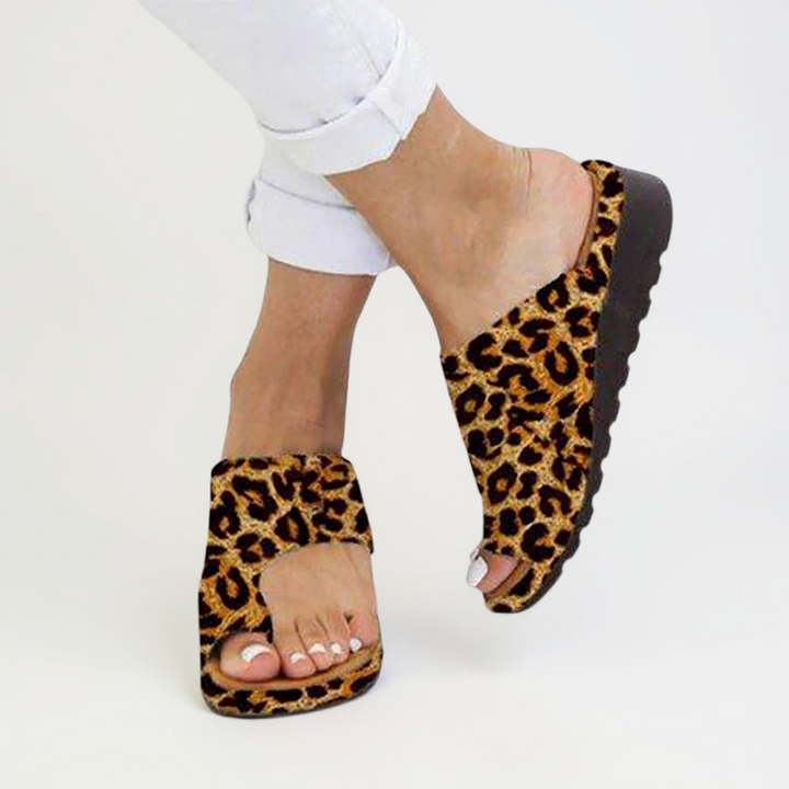 Pair of women's toe split summer sandals with a durable sole, ideal for all-day comfort and support.