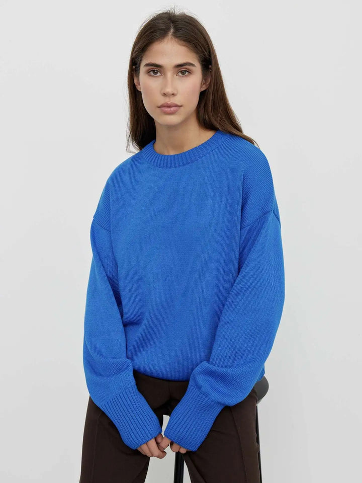 Close-up of the ribbed cuffs on a comfortable women's winter sweater, highlighting texture.