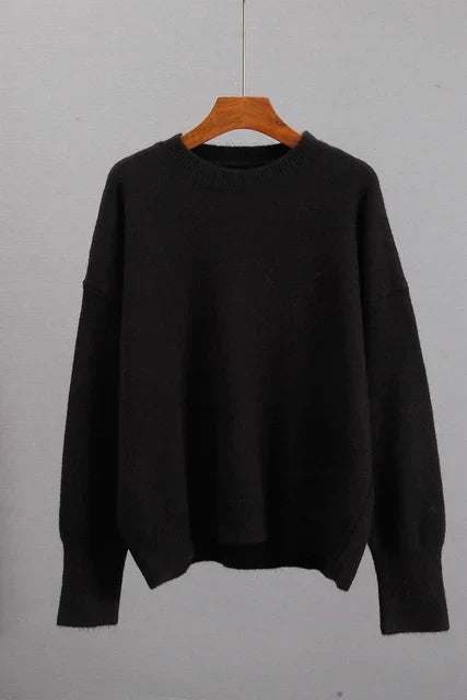 Detail of the knit pattern on a women's comfortable ribbed cuff winter sweater, soft texture.