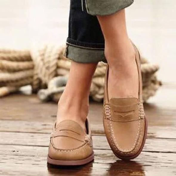 Elegant women's leather slip-on loafers, versatile for office wear or casual outings. Comfortable ladies' flat shoes.