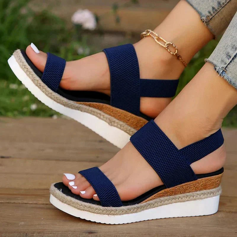 Women's slip-on platform sandals, comfortable & stylish, with stretch straps for casual summer wear.
