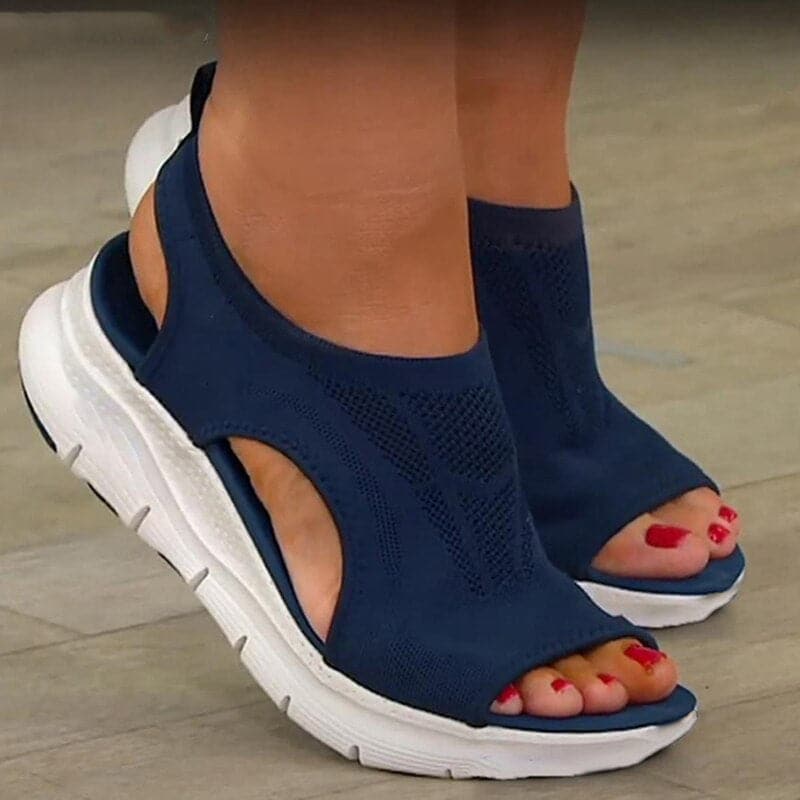 Women's comfortable tan open-toe flat sandals, perfect for spring and casual everyday wear.