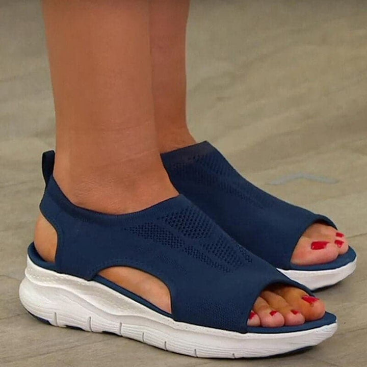 Stylish women's black open-toe sandals with comfortable footbed, ideal for spring fashion.