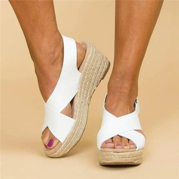 Lightweight women's wedge sandals with adjustable strap, comfortable open-toe for stylish summer wear.