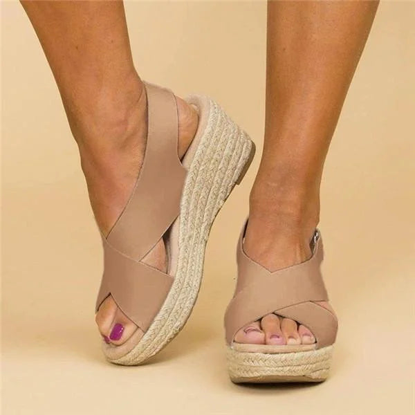 Elegant women's summer wedge sandals, comfortable & stylish for casual or chic outfits.