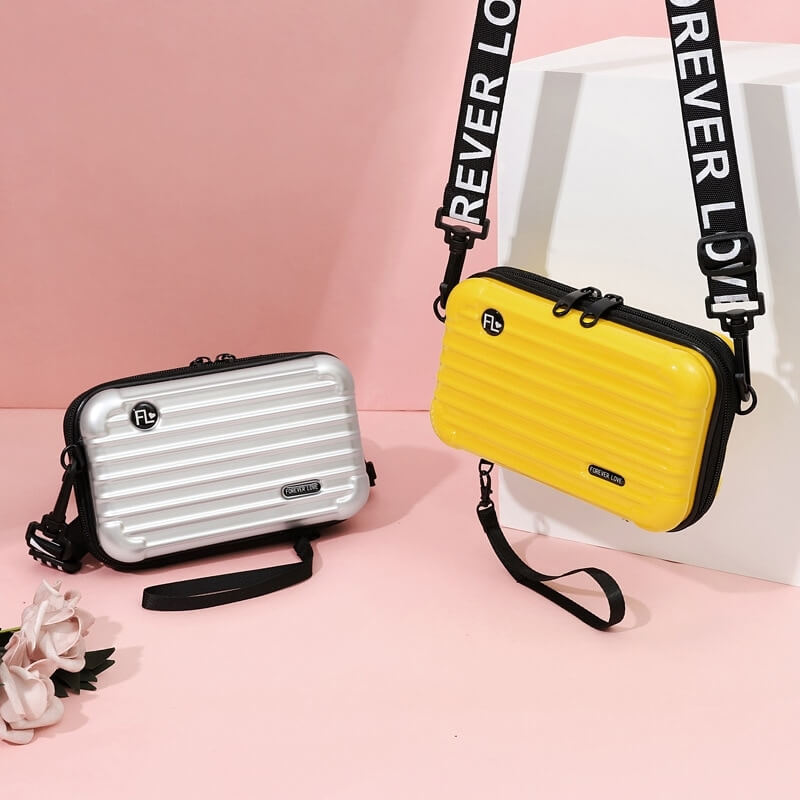 Organized women's hard shell travel handbag; compact, waterproof mini purse for daily essentials.