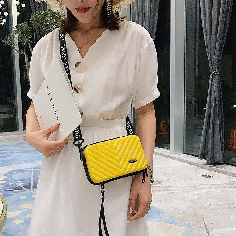 Protective hard shell compact mini purse; women's waterproof crossbody bag for travel essentials.