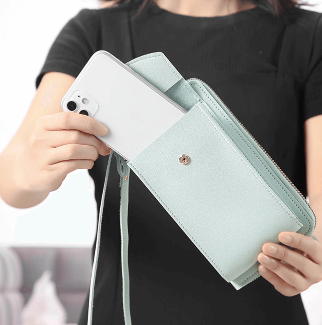 Modern compact women's PU leather crossbody bag, adjustable strap, sleek fashion accessory.