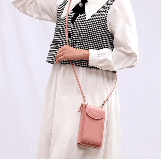 Side view of women's compact PU leather crossbody bag, adjustable strap, sleek small design.